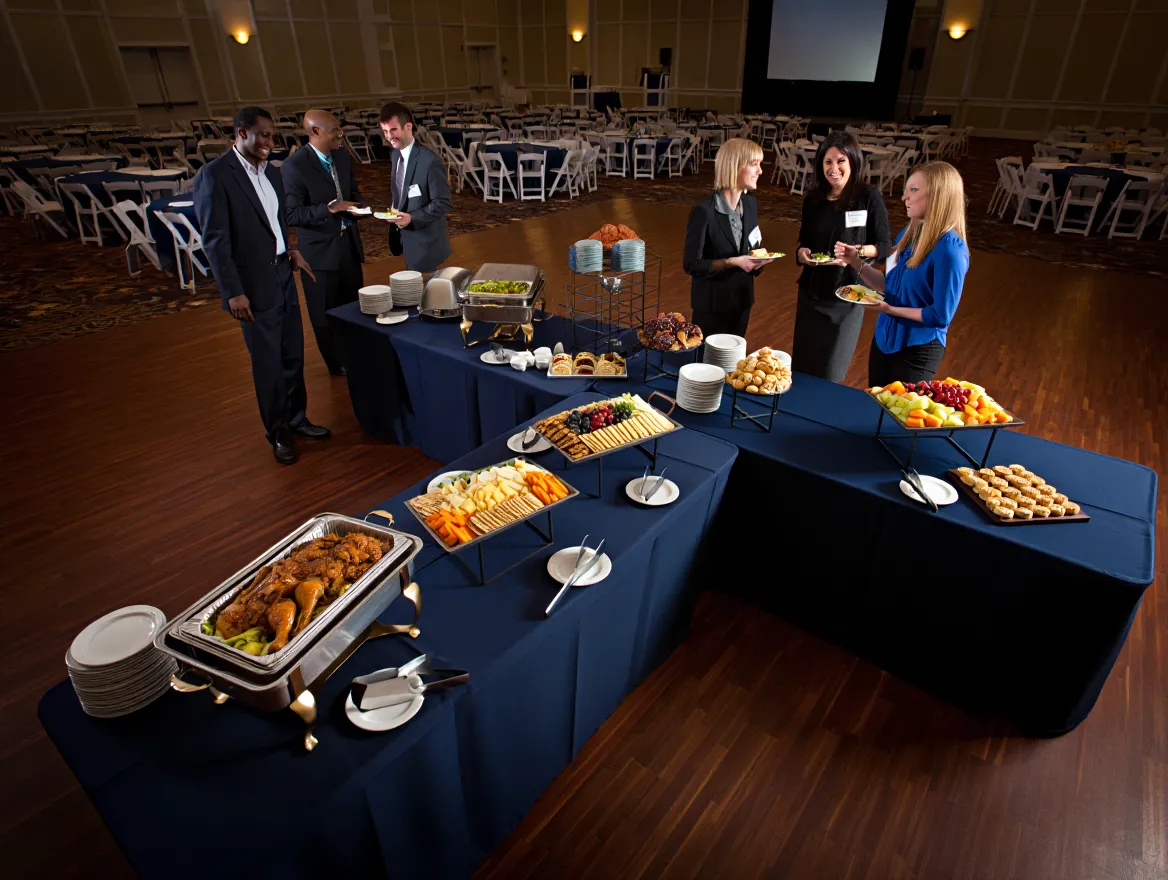 Conference catering with buffet setup and attendees